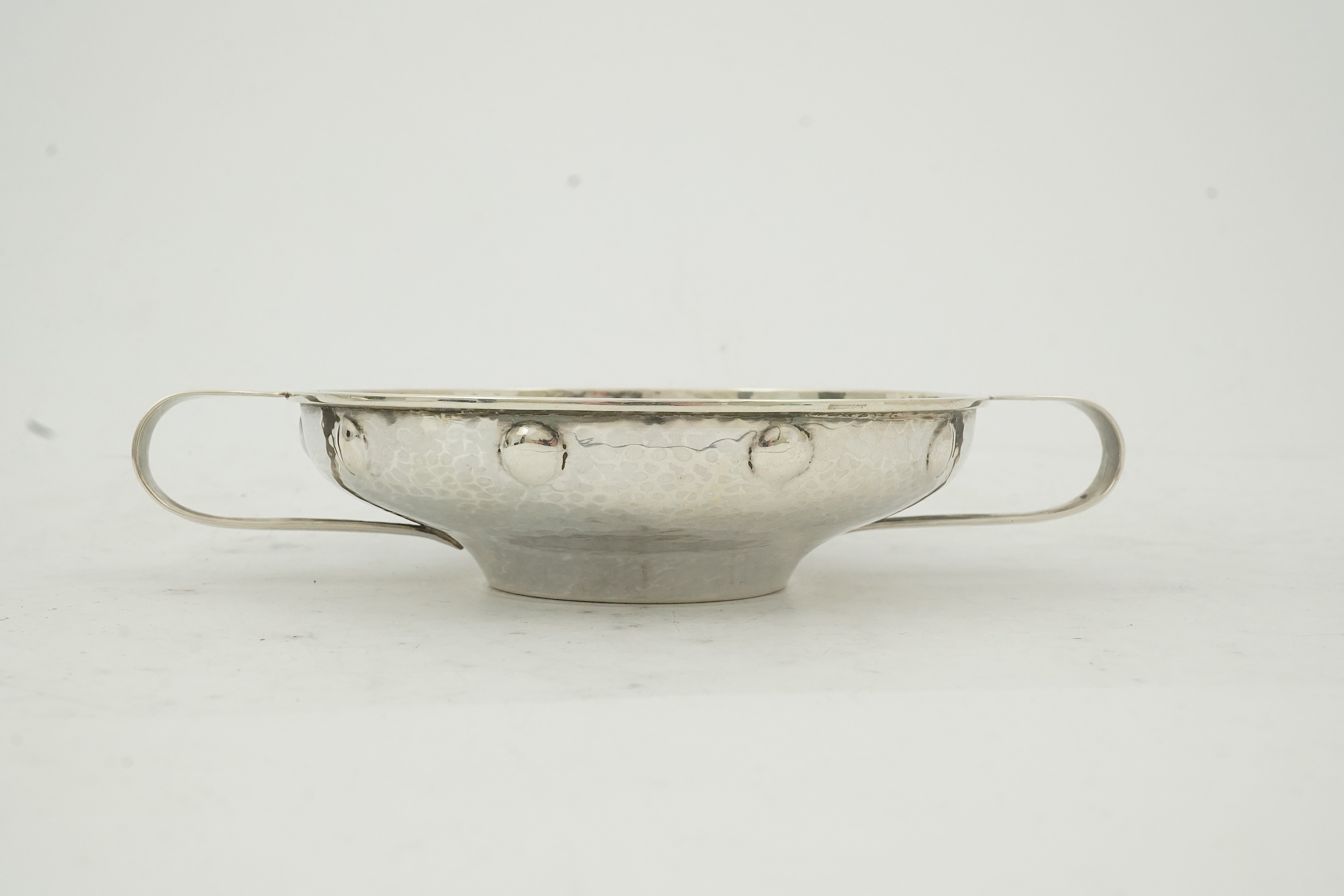 A George V Arts & Crafts planished silver golf related presentation quaich. by Albert Edward Jones